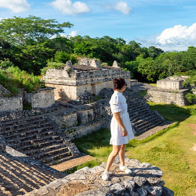 Woman overlooking Mayan Ruins