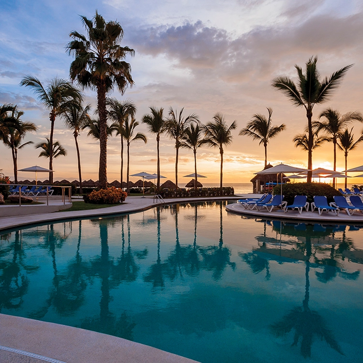 mexico resort pool at sunset