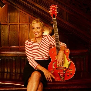 Jill Sobule holding her electric guitar
