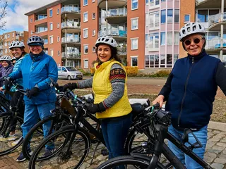 Olivia Guests bicycling through Amsterdam